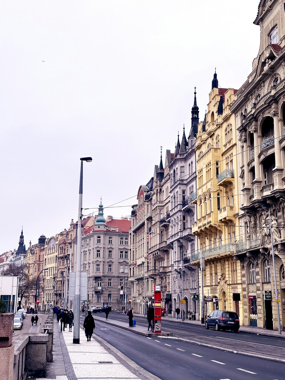 a city street lined with tall buildings next to each other