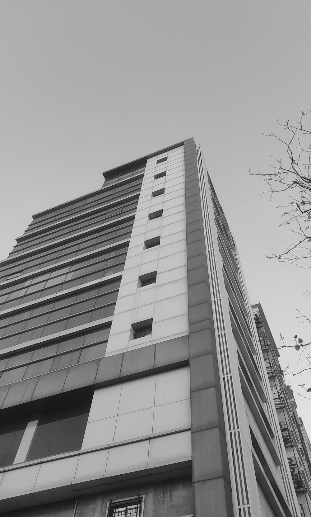 a black and white photo of a tall building