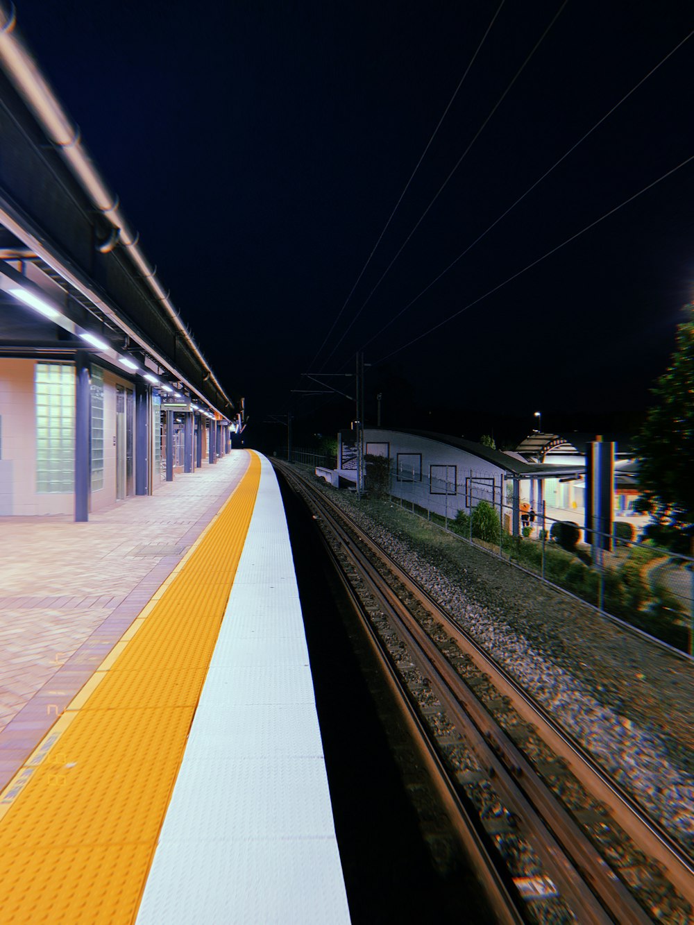 a train station with a train on the tracks