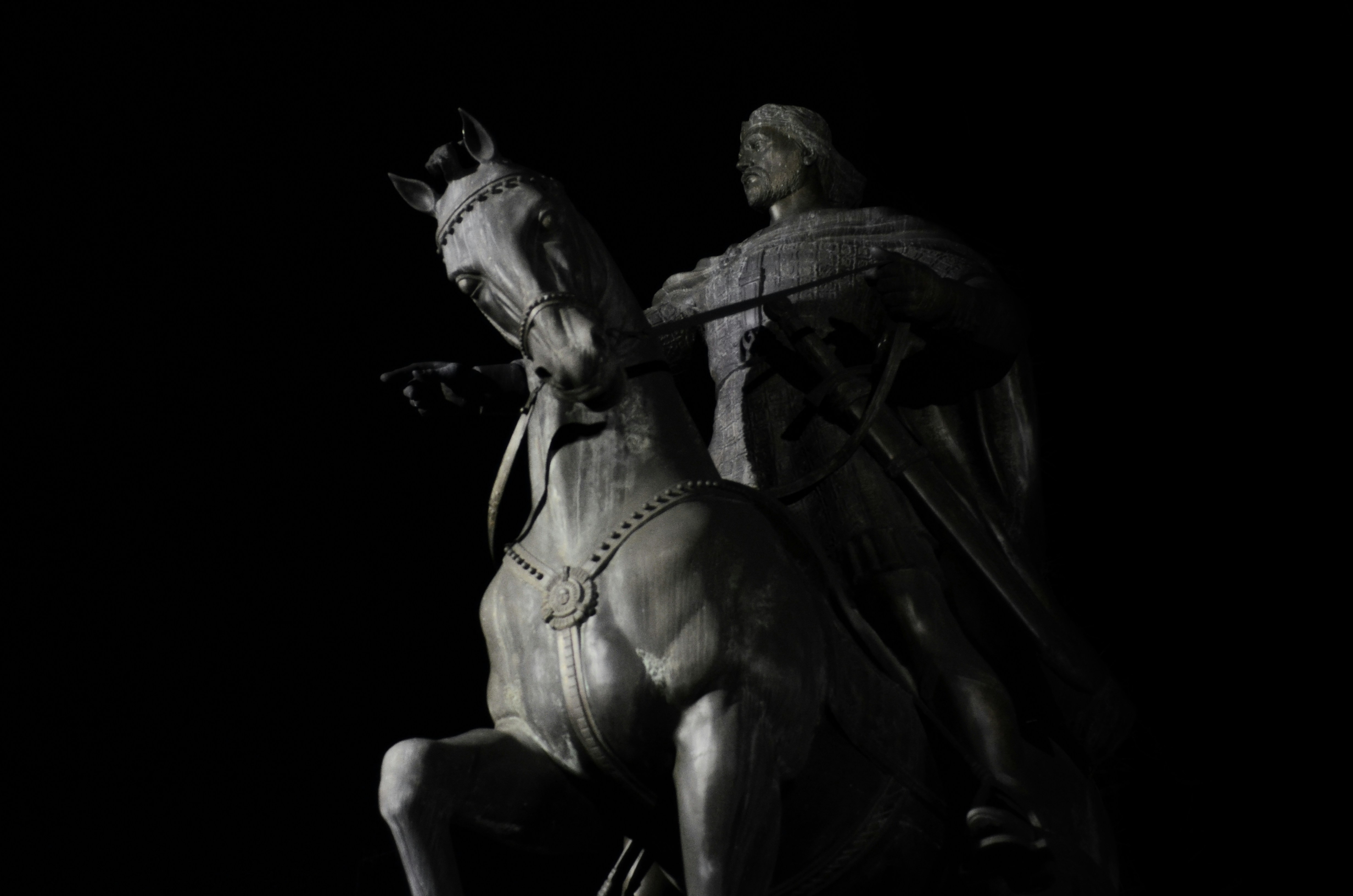 a statue of a man riding on the back of a horse