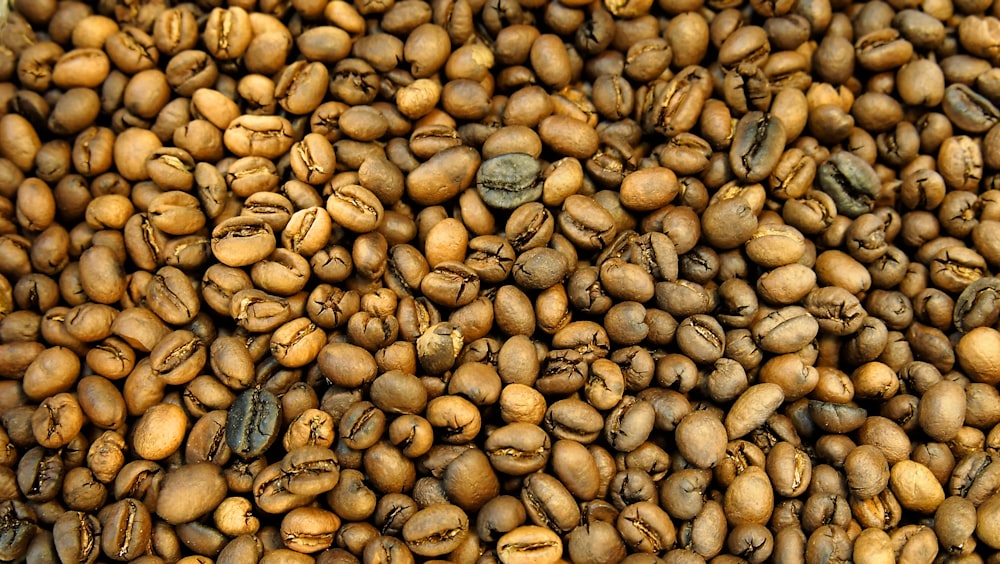 a pile of coffee beans with coffee beans in the middle