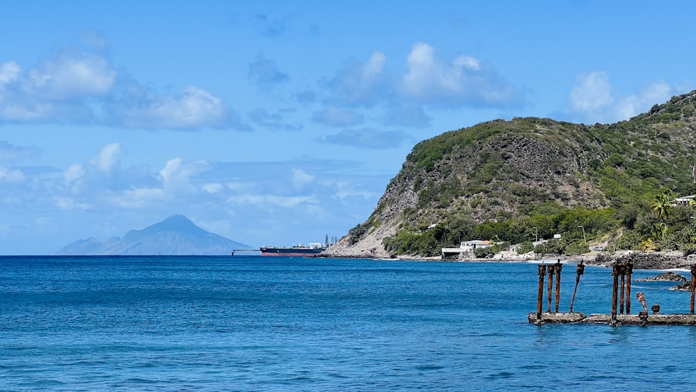 a body of water with a mountain in the background