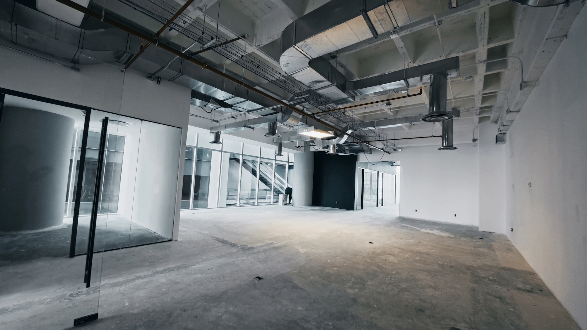 an empty room with a lot of glass doors
