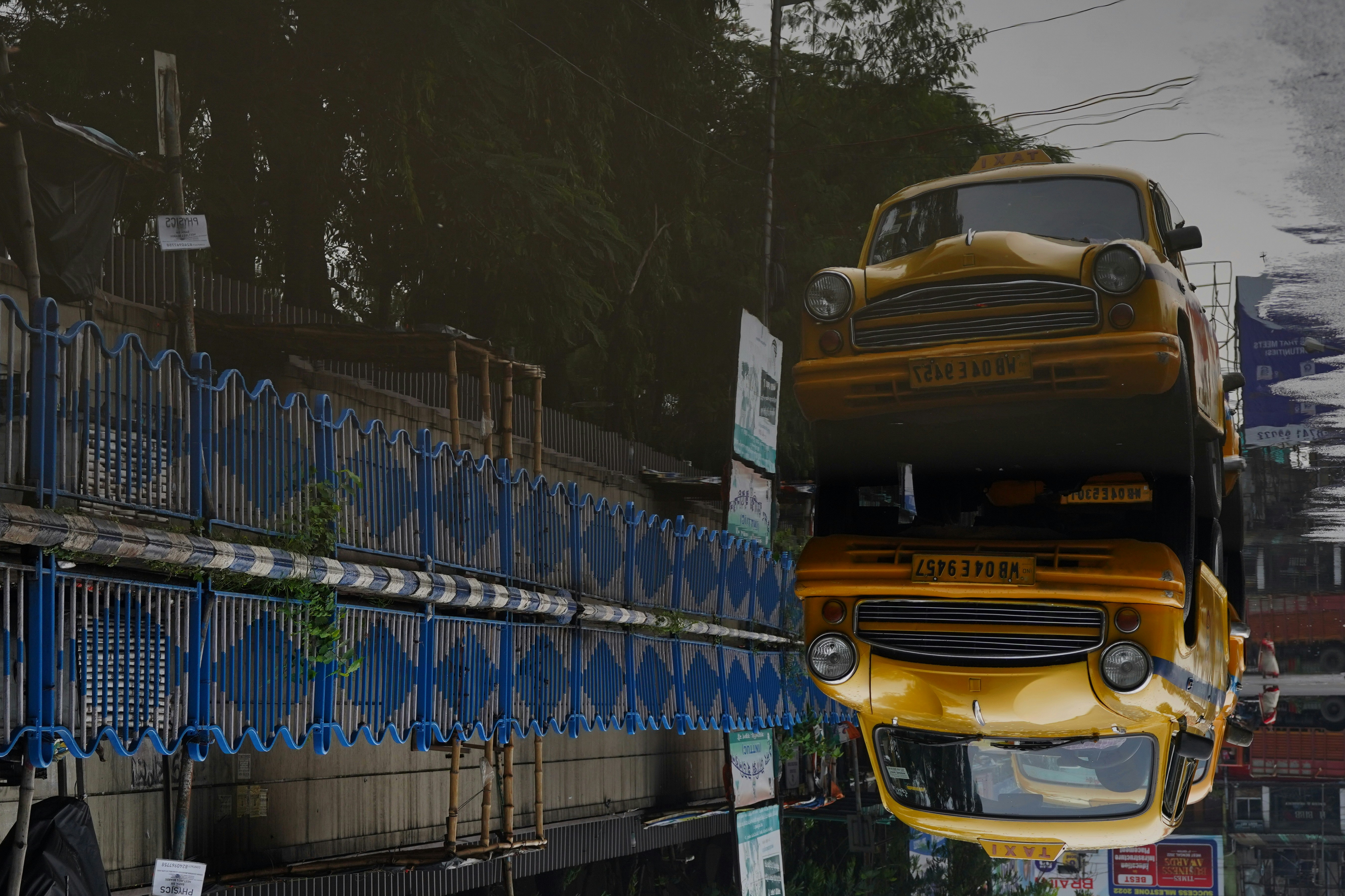 a yellow truck is in front of a building