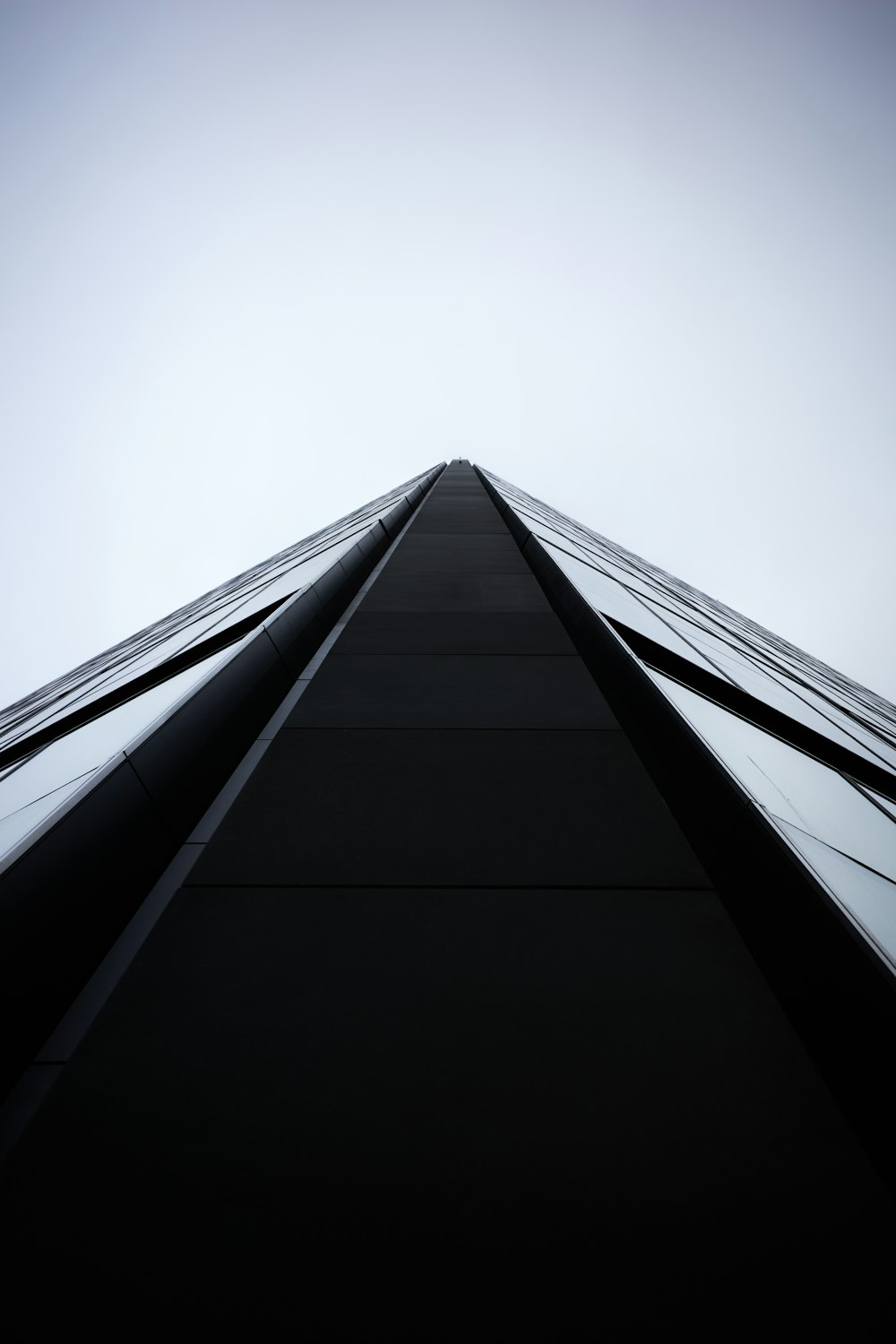 a very tall building with a sky in the background