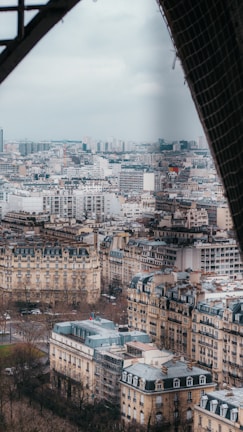 A panoramic view of a Middle Eastern city skyline with French cultural landmarks.