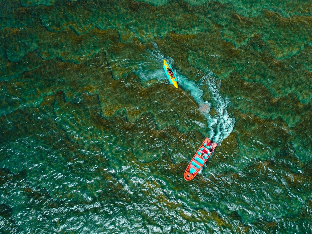 a couple of people on a boat in the water