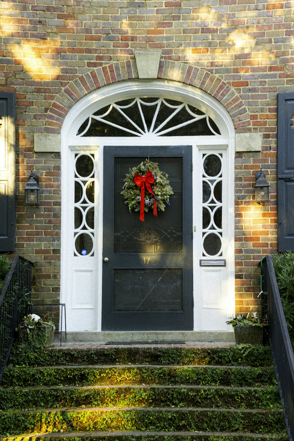 a front door with a wreath on it