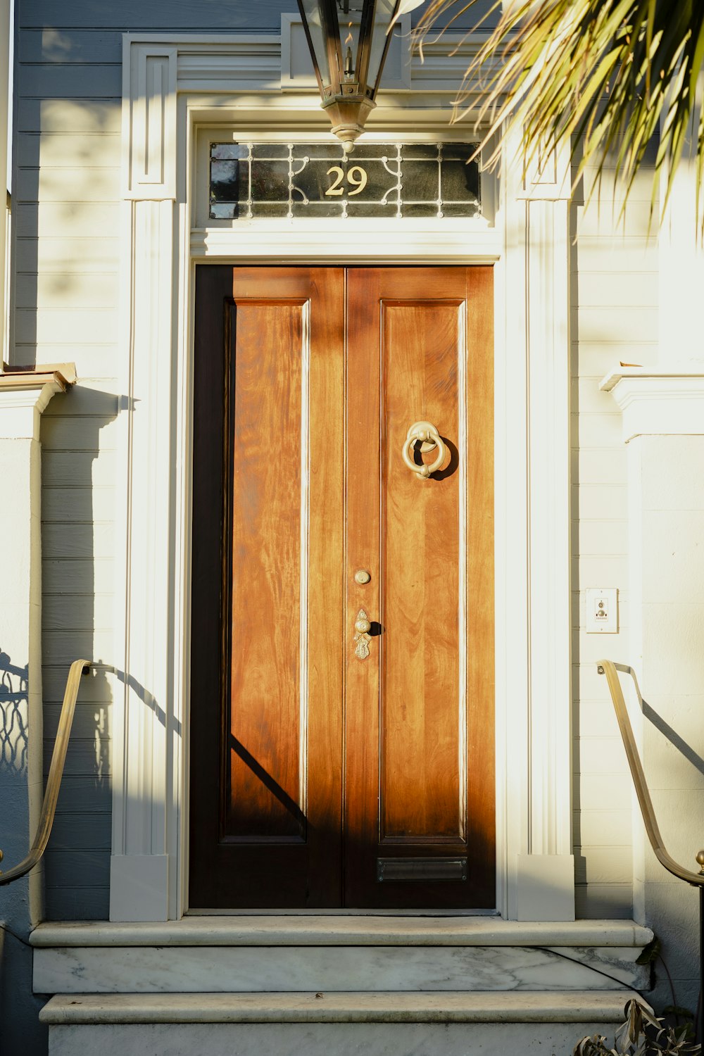 a wooden door is on the side of a house