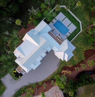 an aerial view of a house with a swimming pool