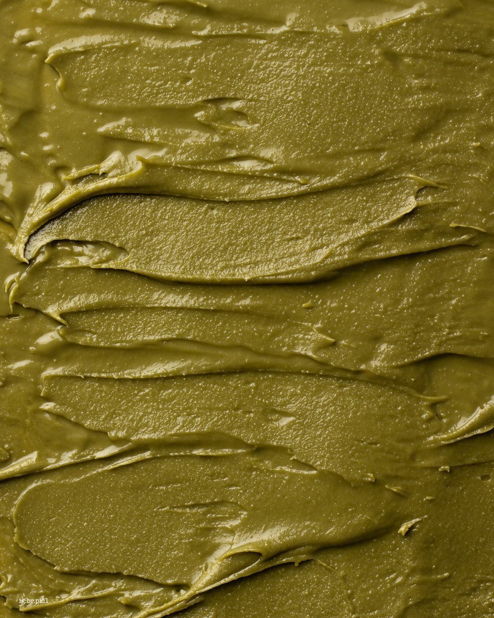 a close up of a cake with green frosting