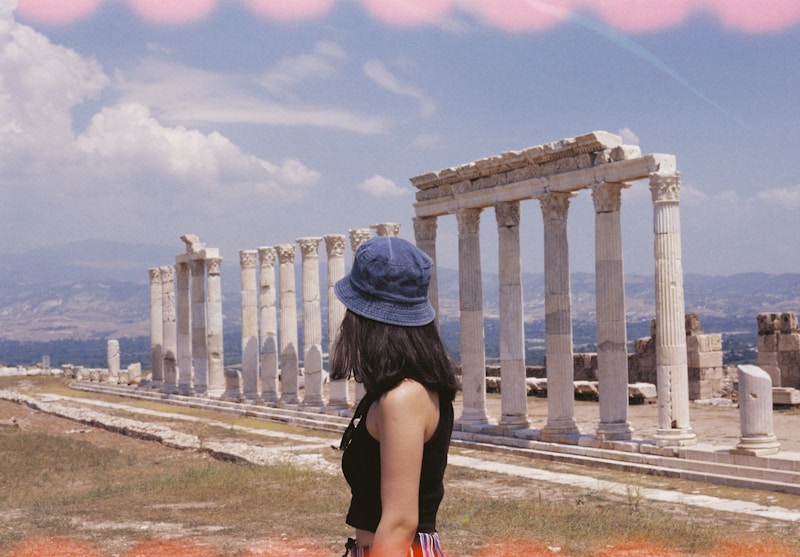 Elegant woman in classical Greek setting