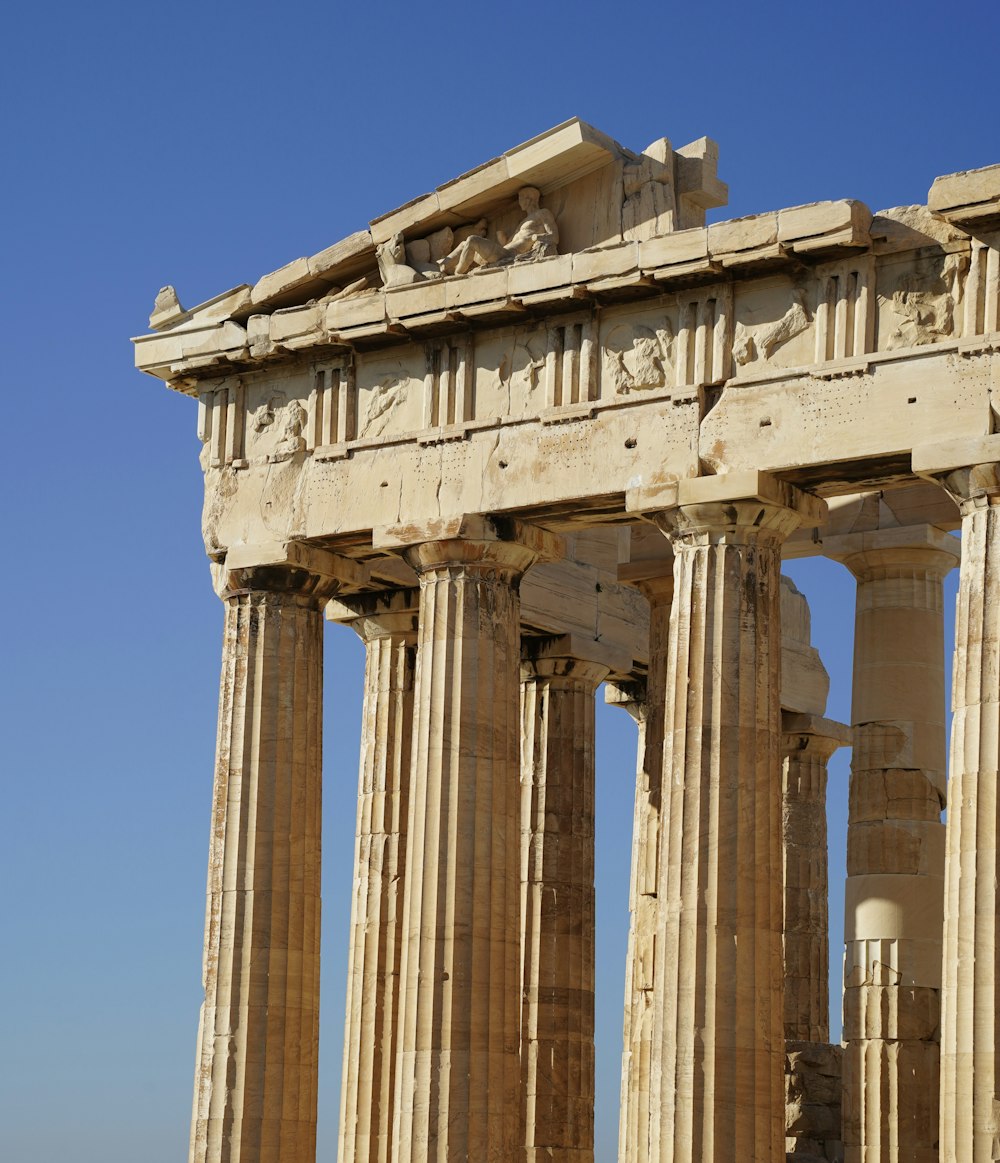 a very tall building with some columns on top of it