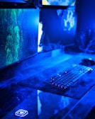 Close-up of a high-tech computer setup with keyboards and monitors.