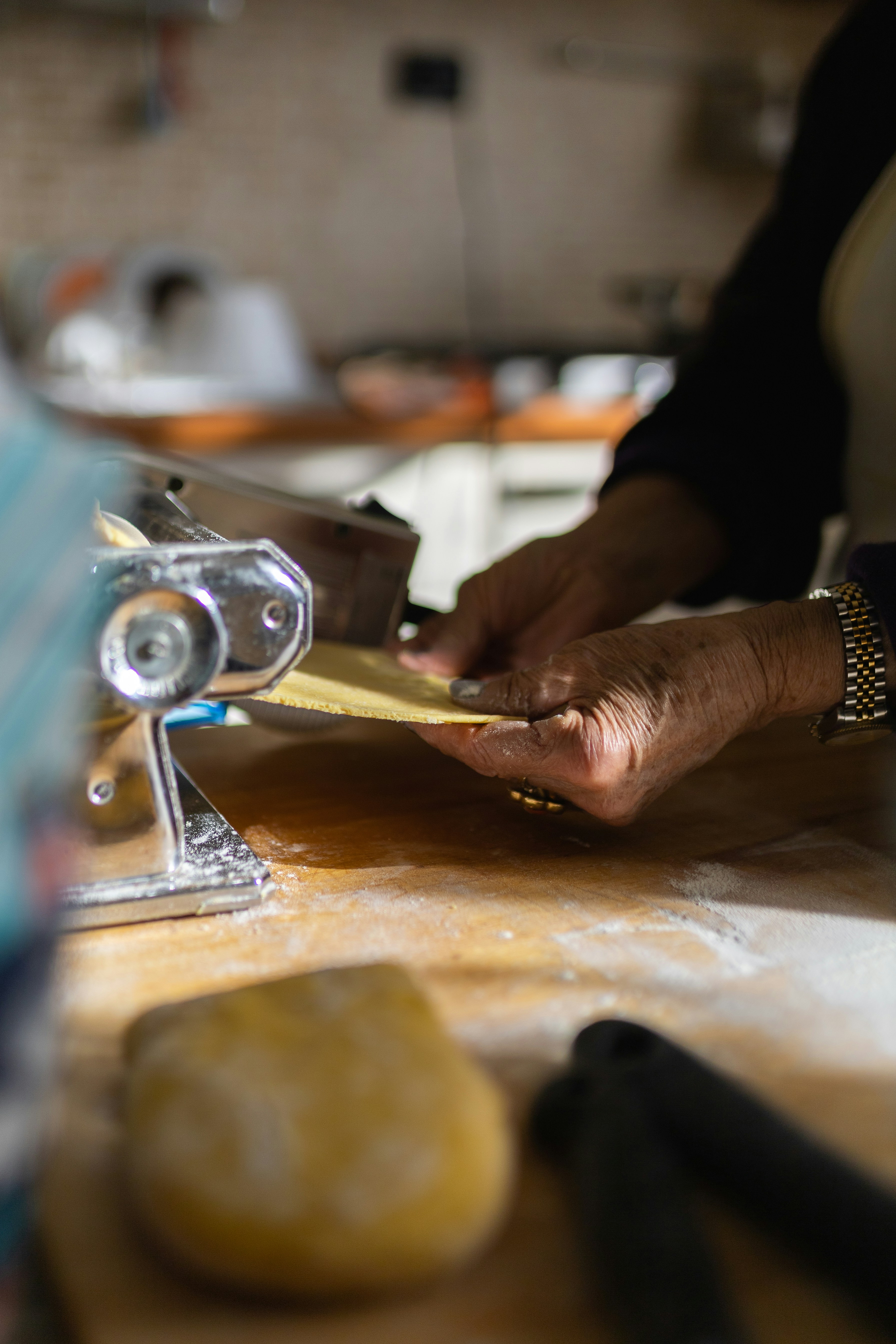 a person is working on a project in a kitchenby Lorenzo Tomassetti
