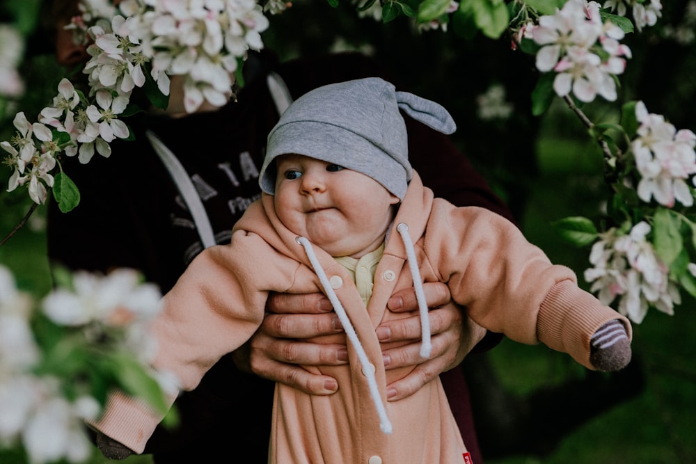 a person holding a baby doll in their arms