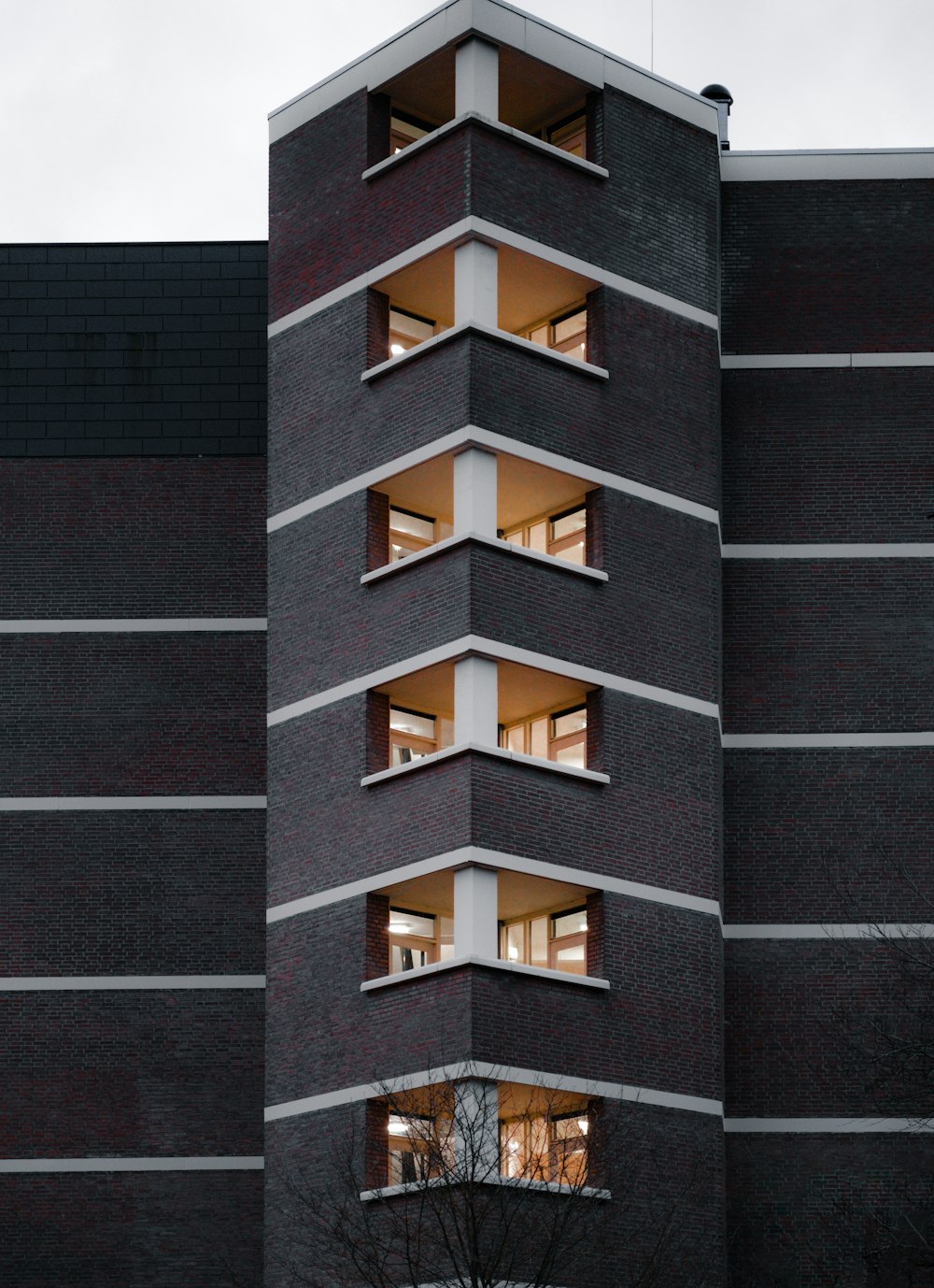 a tall building with multiple balconies on top of it