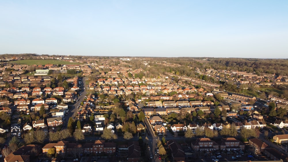 an aerial view of a city with lots of houses