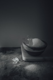 An artistic arrangement of salt in different containers.