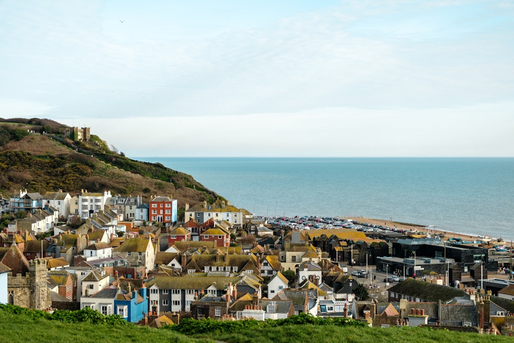 a view of a town on a hill overlooking the ocean