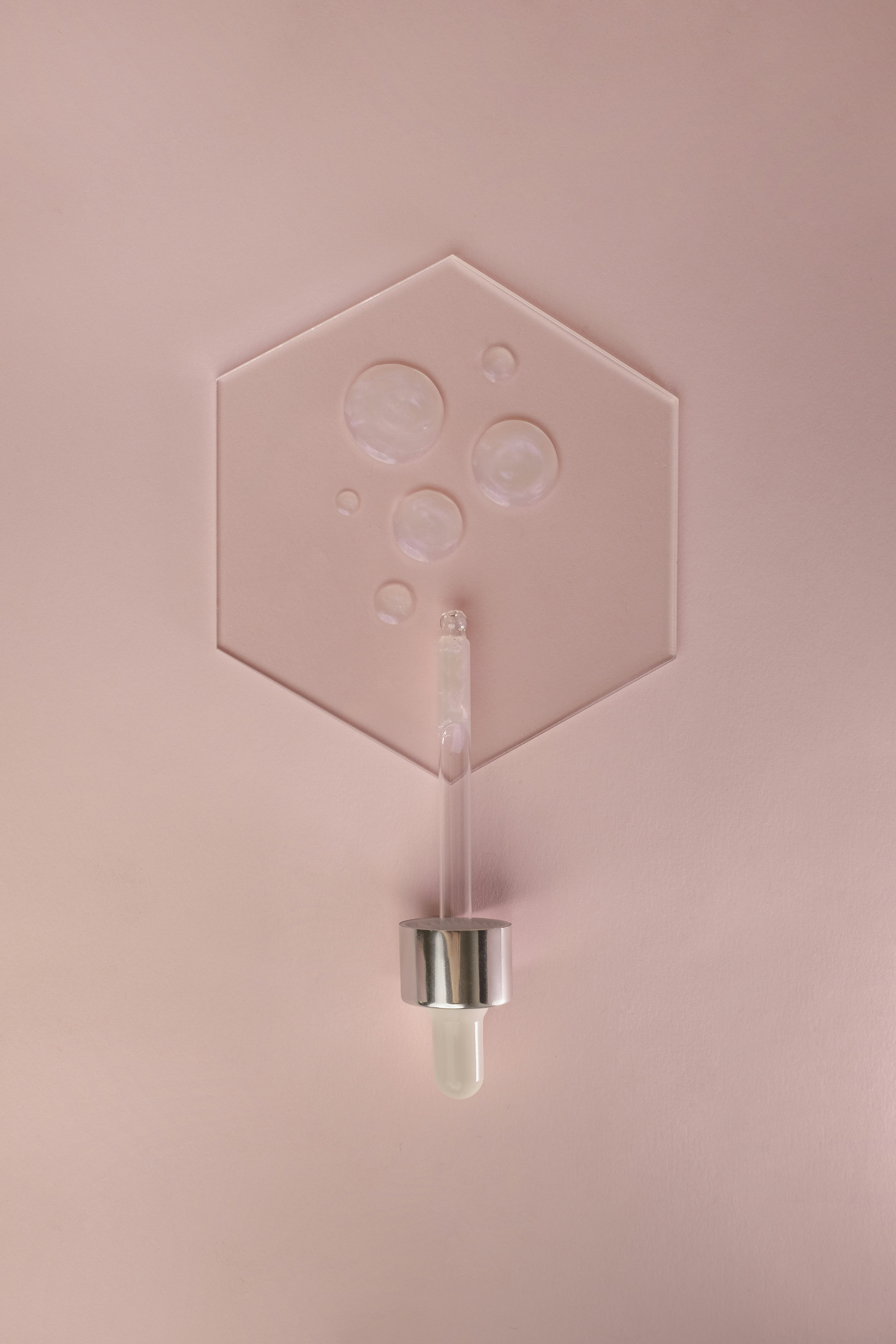 a pink room with a light on the ceiling