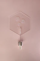 Custom acrylic support pieces arranged neatly on a minimalist white surface.