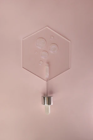 Custom acrylic support pieces arranged neatly on a minimalist white surface.