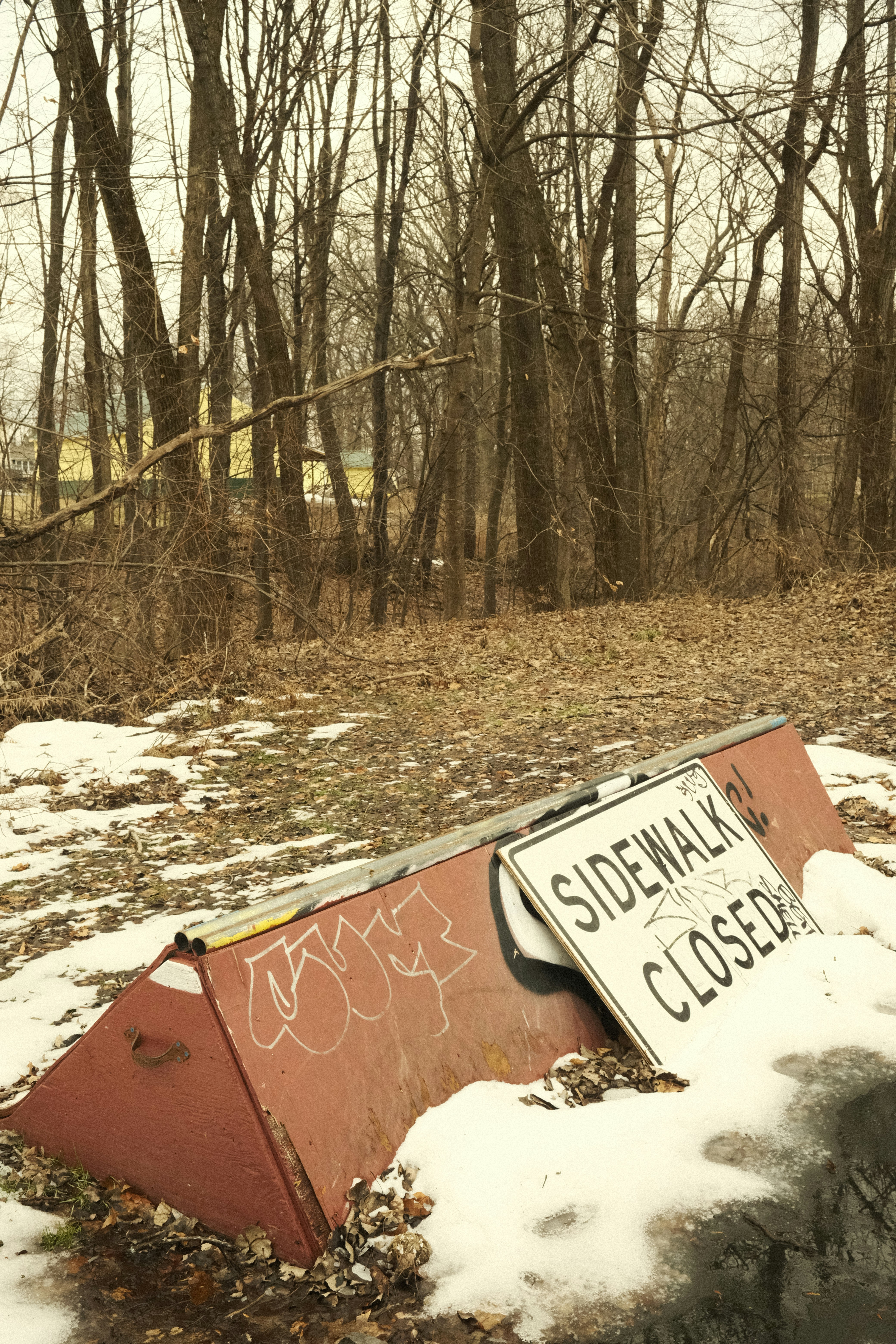 a skateboard that is laying in the snow