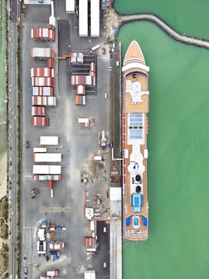 Aerial view of multiple cruise ships docked at a bustling port.