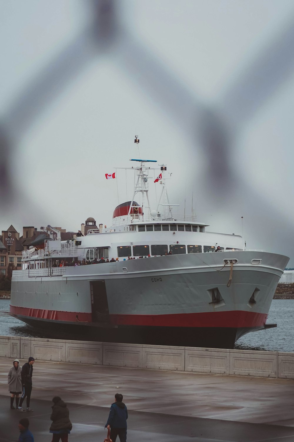 a large white and red boat in the water