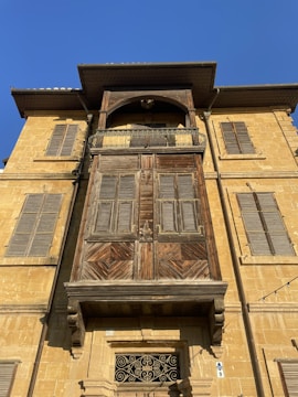 Freshly restored building facade showcasing clean, restored woodwork and fresh paint.