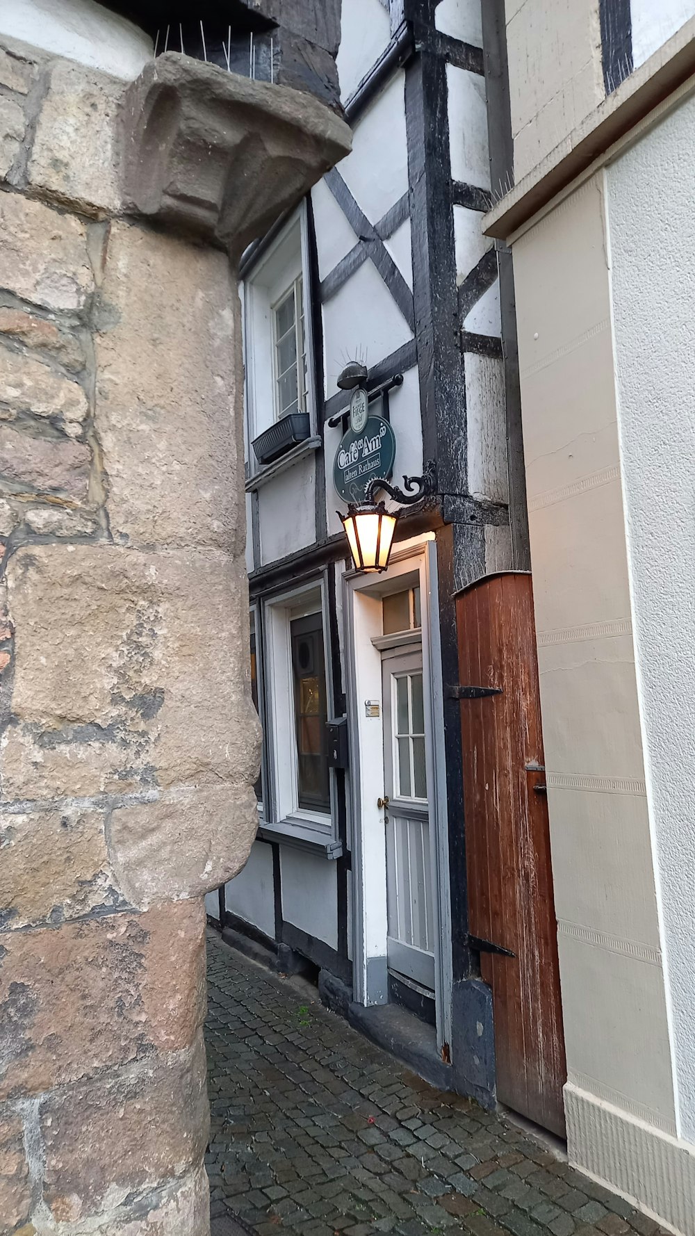 a building with a lamp on the side of it