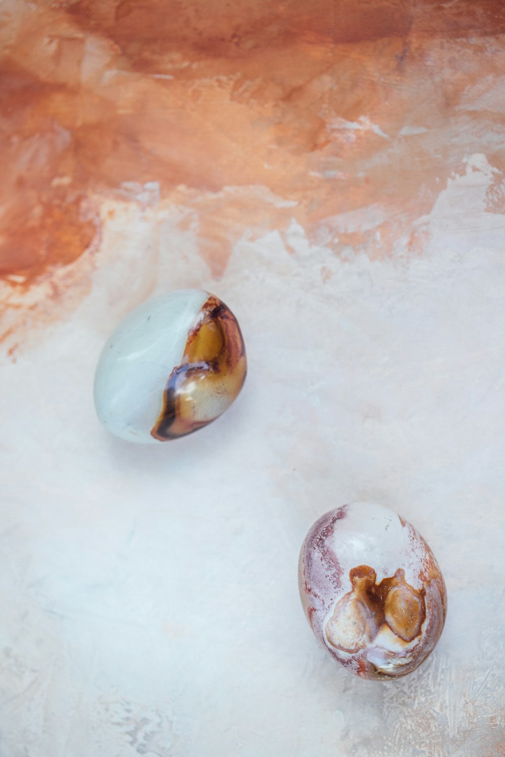 a couple of pieces of fruit sitting on top of a table