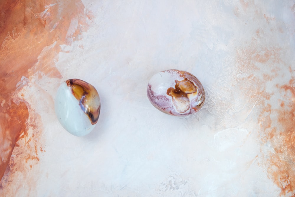 a couple of doughnuts sitting on top of a table