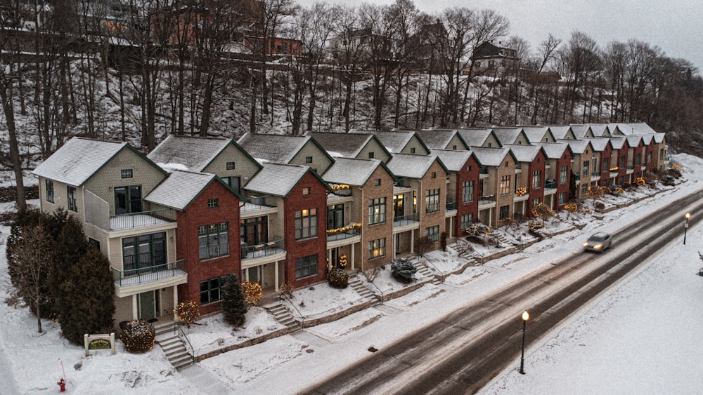 a row of houses on a snowy street