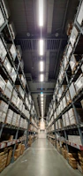 A large warehouse aisle, perfectly organized and cleaned, with a subtle magical glow.