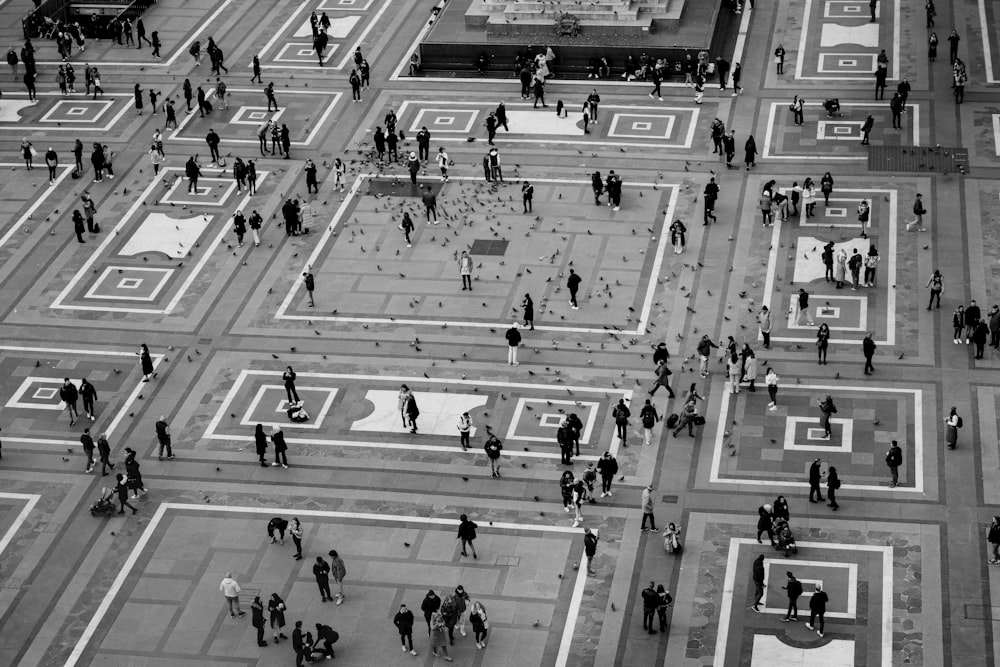 a black and white photo of people walking on a street