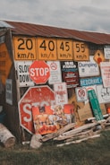 A variety of road sign boards displayed in a warehouse ready for shipment.
