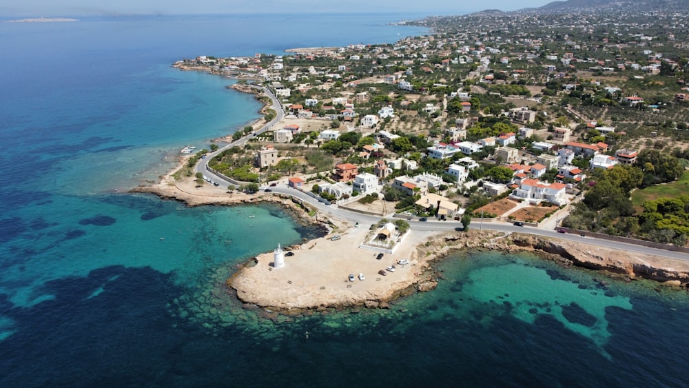 an aerial view of a small town by the ocean