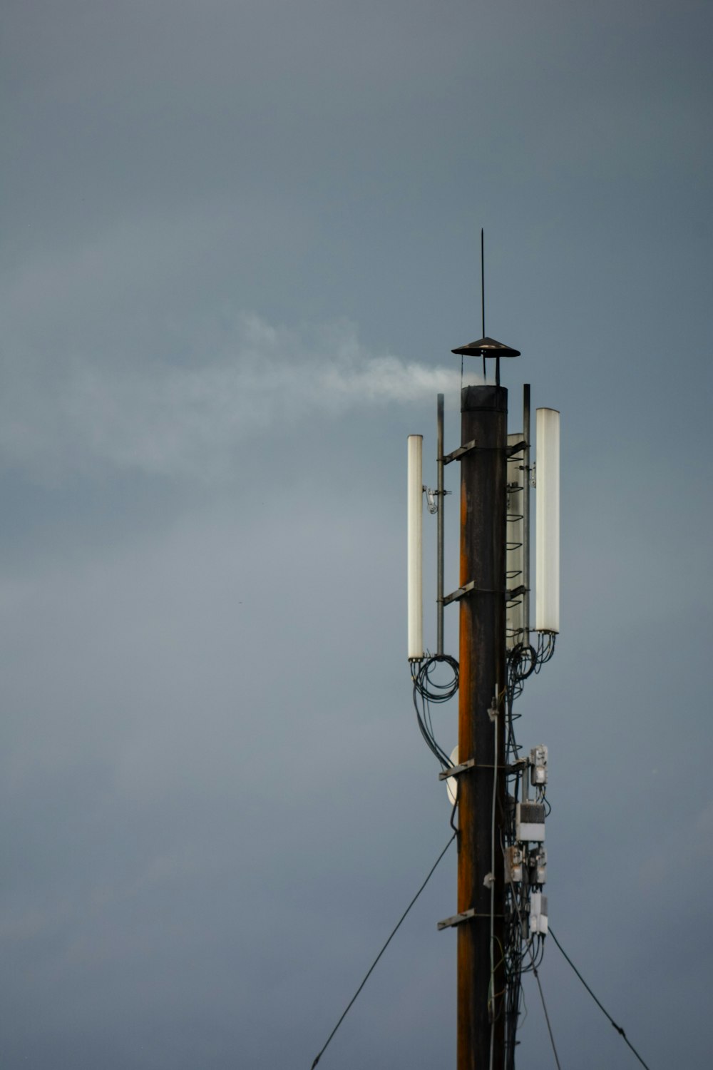 a cell phone tower with a sky background