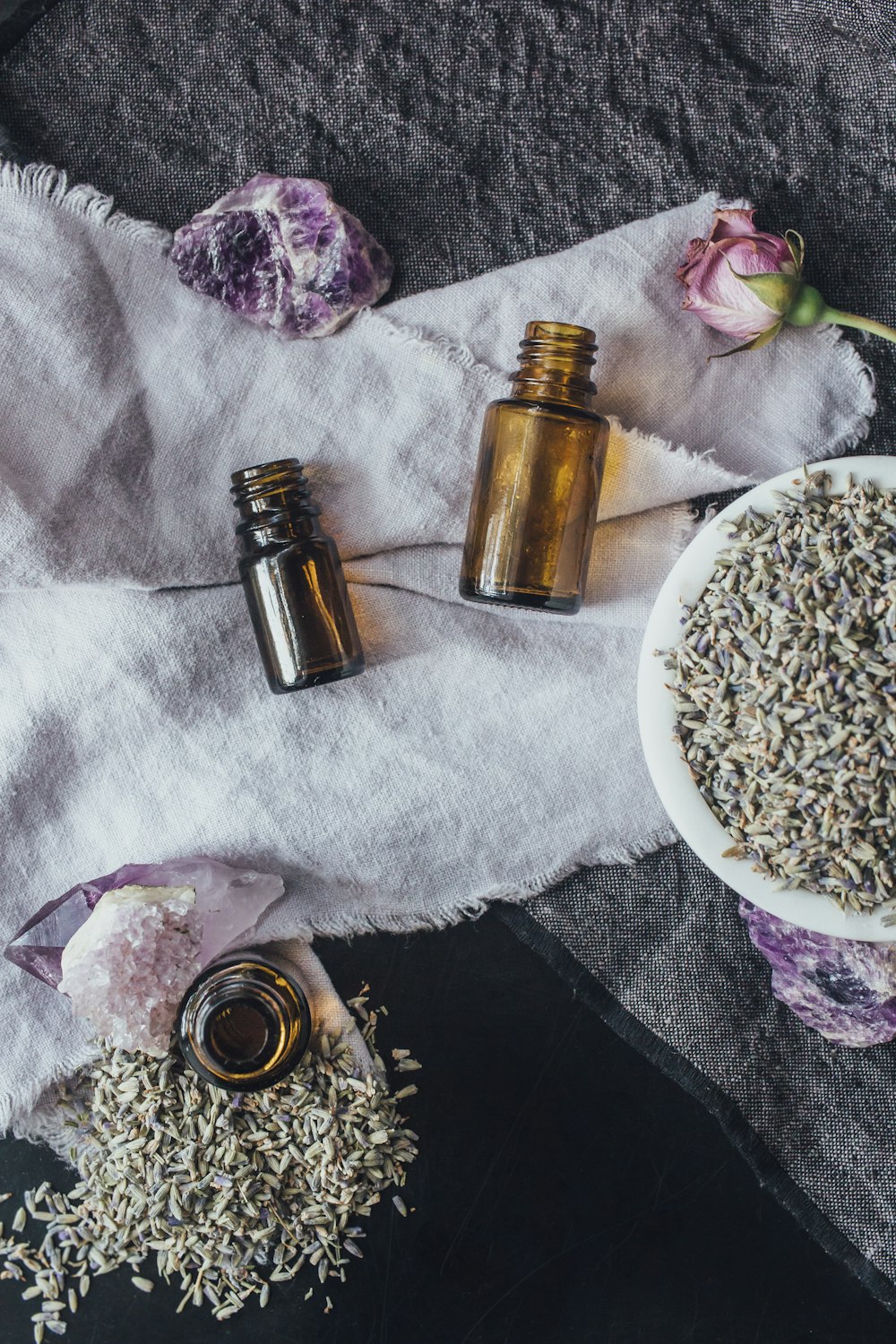 a table topped with bottles of essential oils