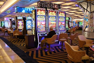a casino room filled with lots of slot machines