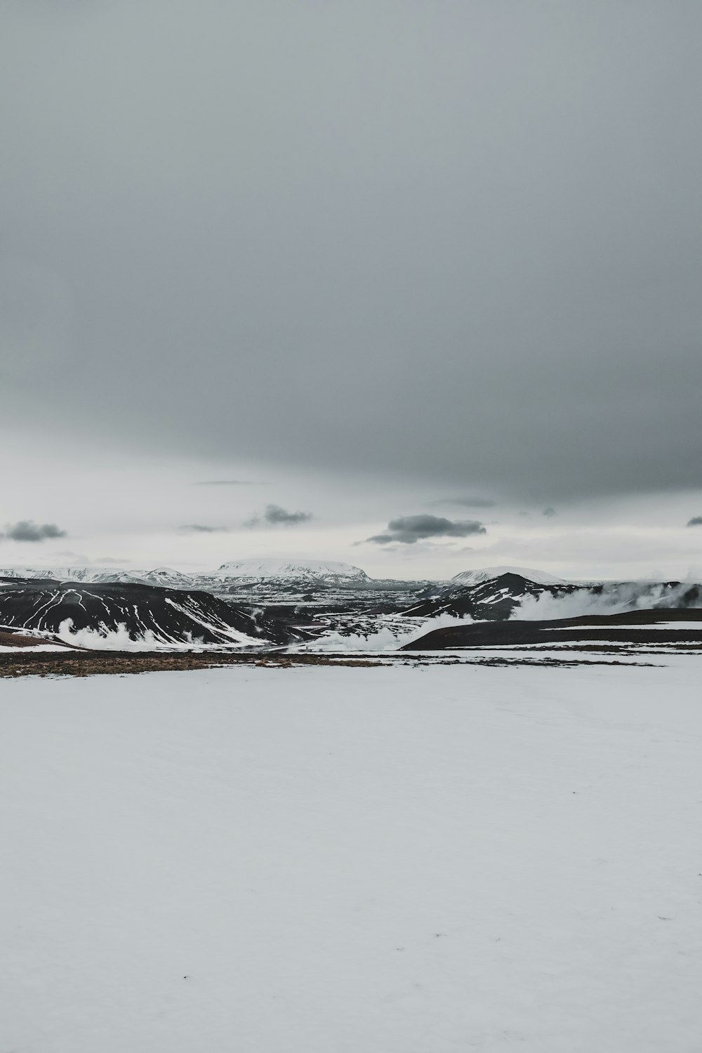 a man riding skis on top of a snow covered slope