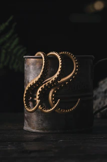 A giant squid monster rising from dark ocean waves, tentacles wrapped around treasure chests.