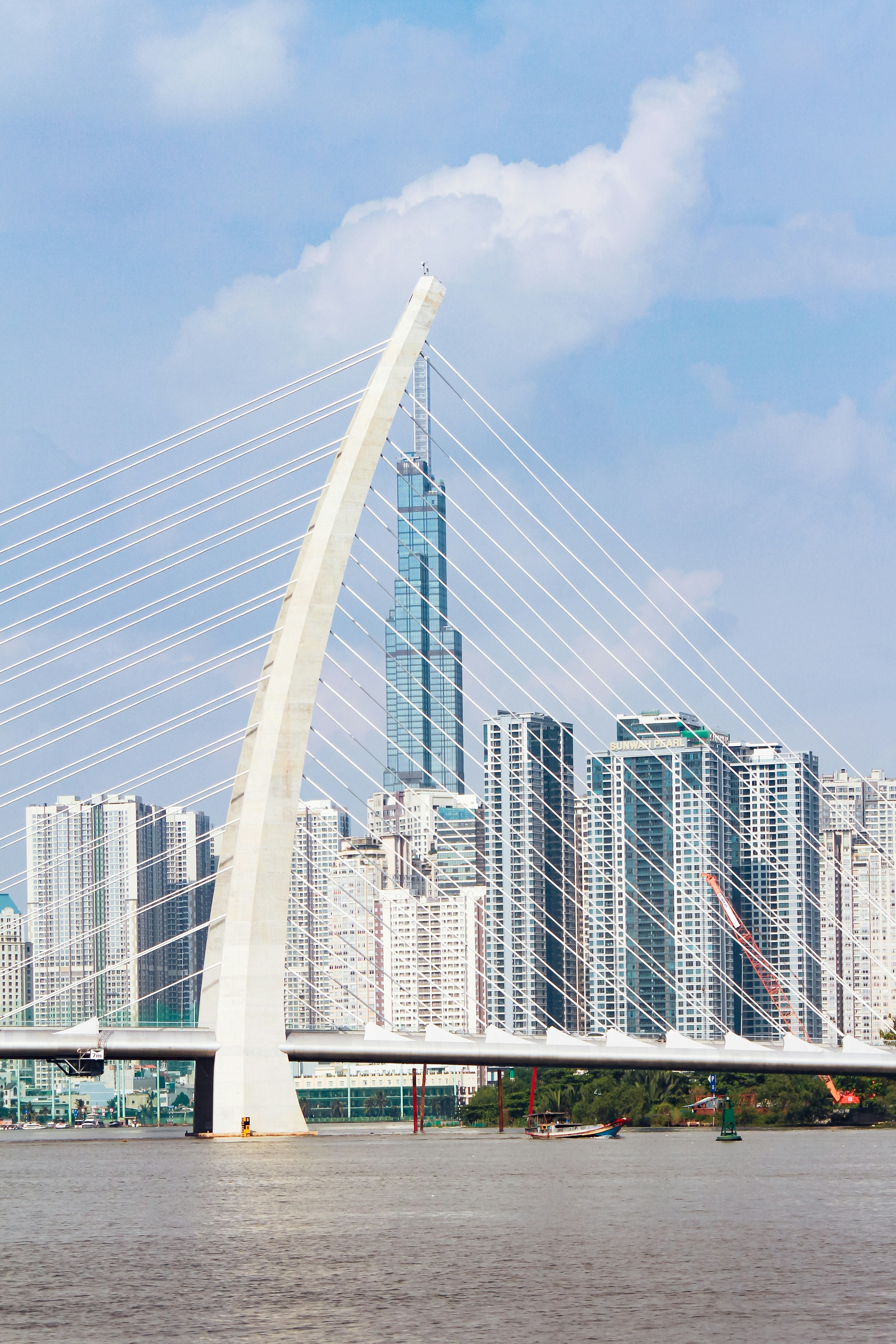 a bridge with a very tall building in the background
