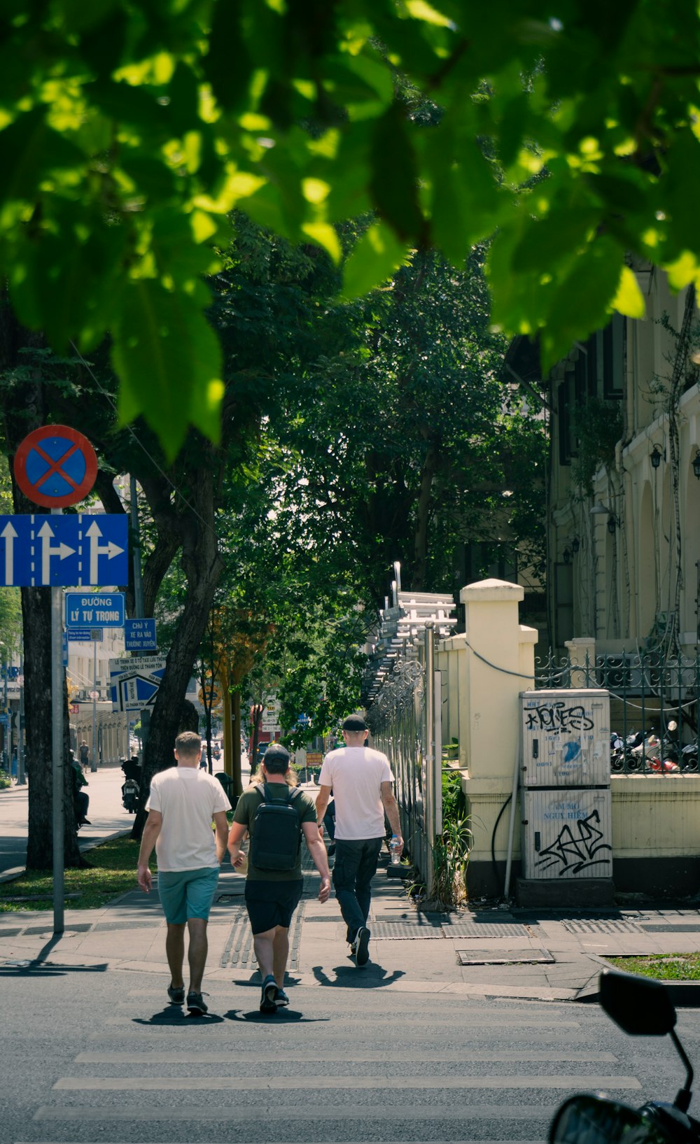 a group of people walking down a street