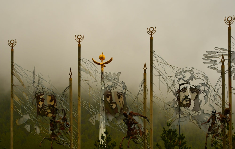a painting of a group of people surrounded by tall poles