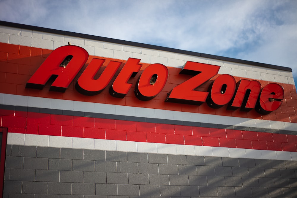a auto zone sign on the side of a building