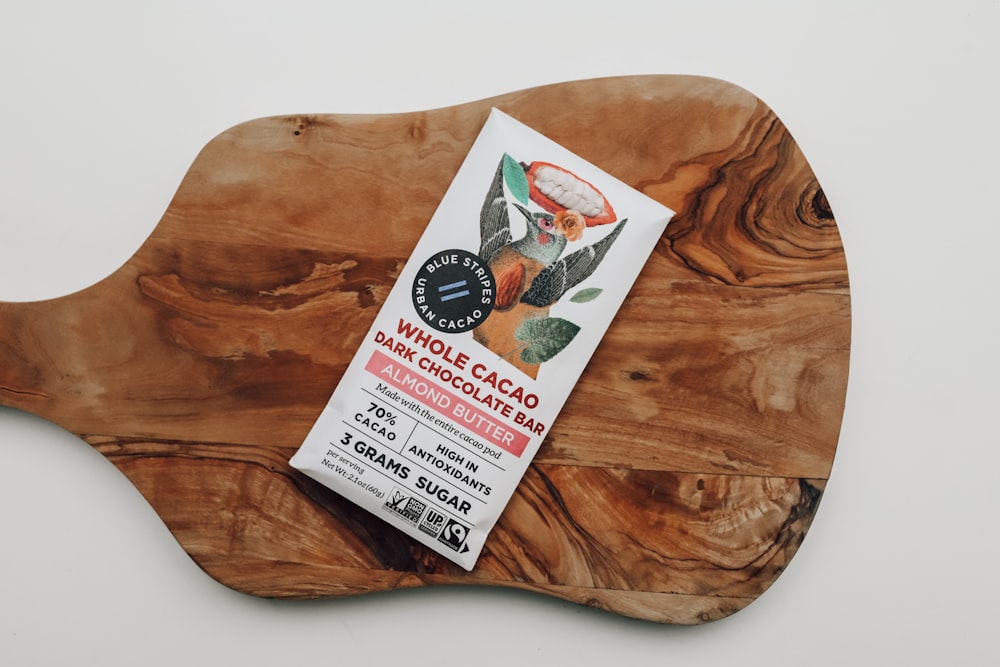 a wooden cutting board with a label on it