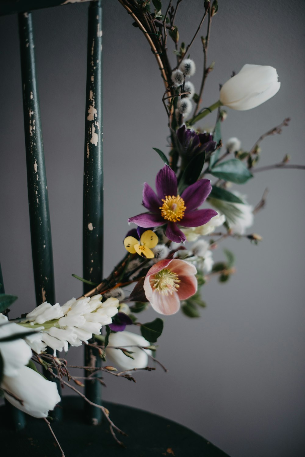 a bunch of flowers sitting on top of a chair